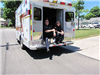 Paramedics Sit in Back of Ambulance