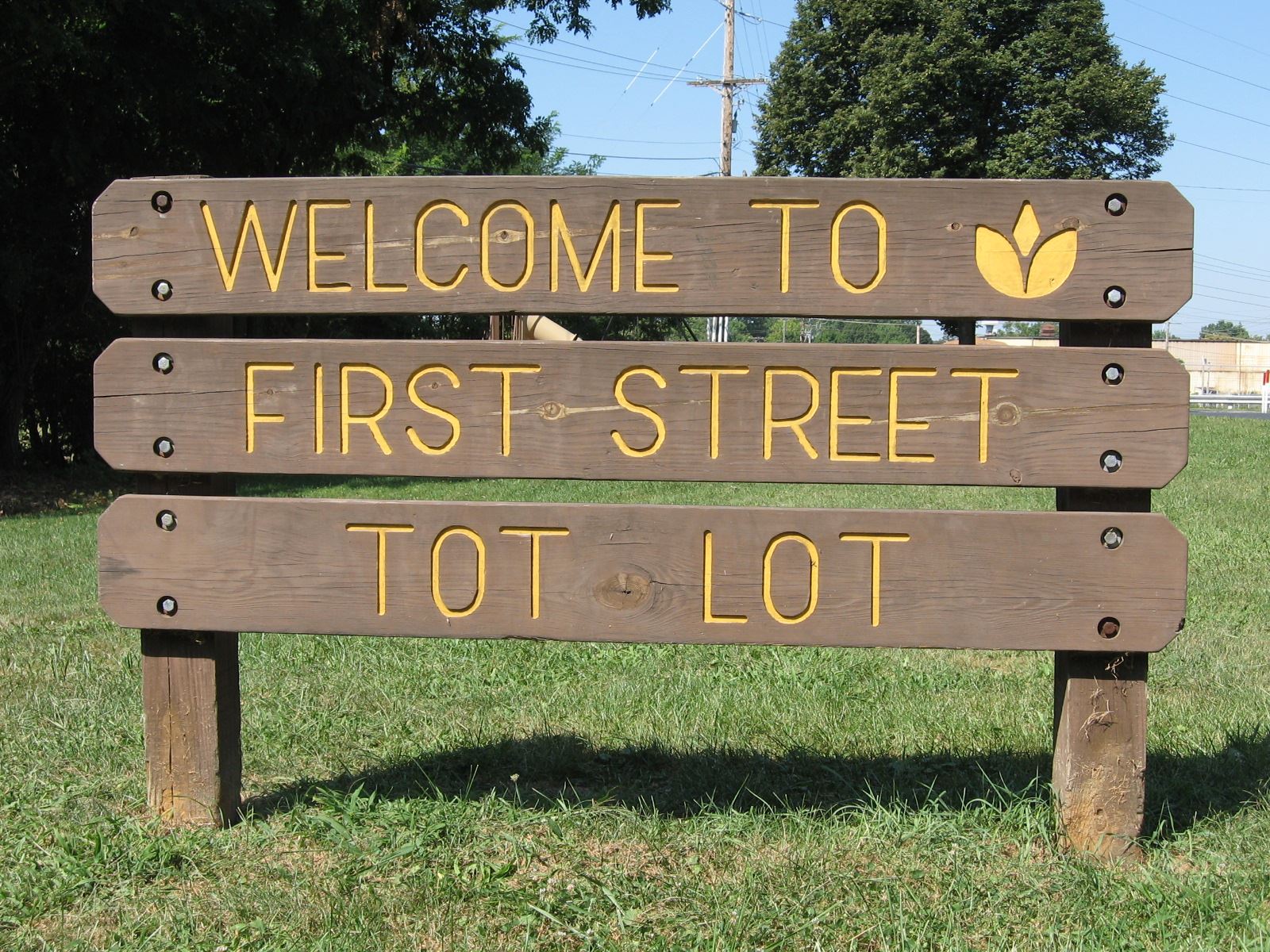 Welcome to First Street Tot Lot Sign
