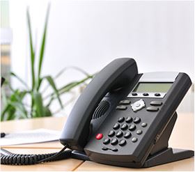 Office phone on a wooden desk