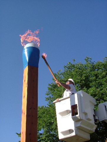 Man Lights the Oversized Blue Tip Match