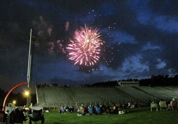 Crowd in Football Field Watches Firework Show