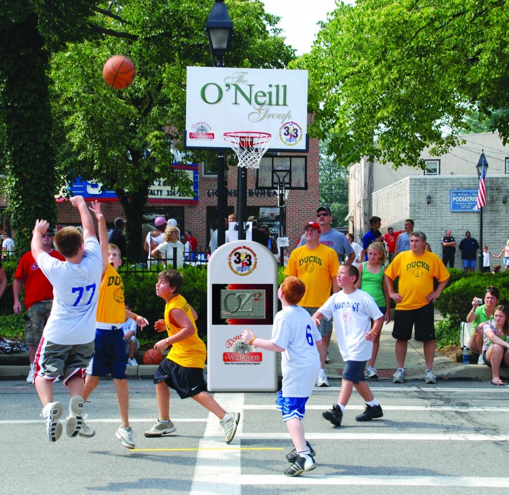 Boy Takes Shot During 3 on 3 Basketball Game