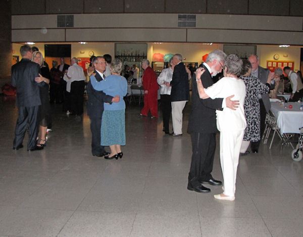 Men and women dancing together.