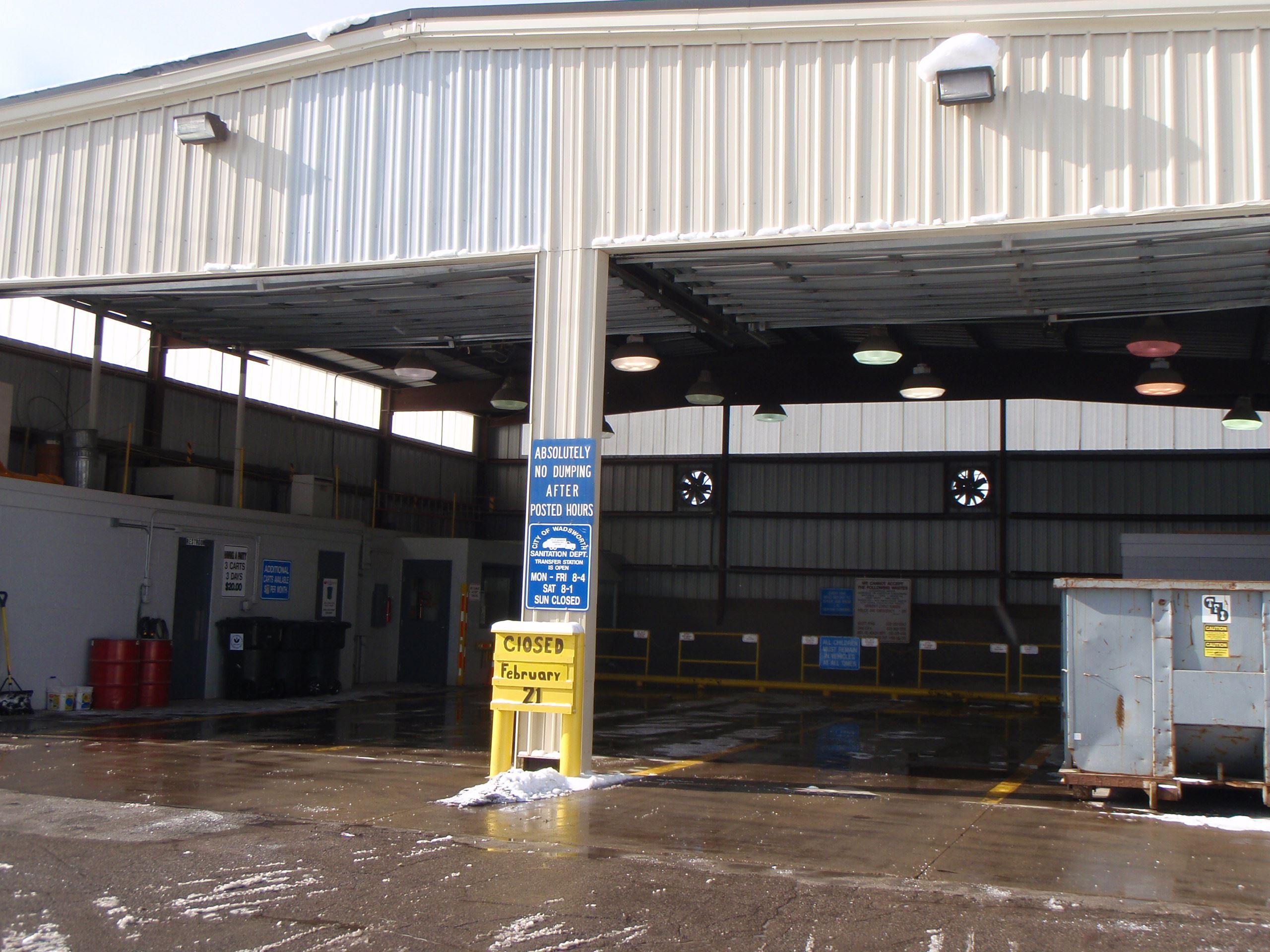 A large garage building with its doors open.